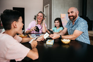 Family playing a board game 