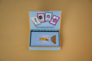 Card game box with cards featuring